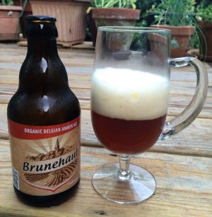 Bottle and glass of Brunehaut Belgian Organic Amber beer