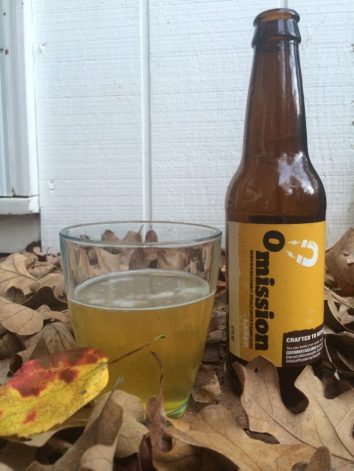 Omission Lager bottle and glass with fall leaves